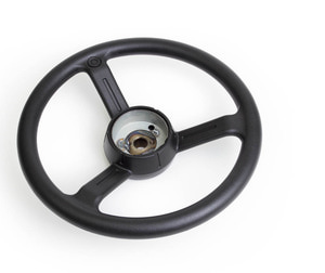Overmolded steering wheel with soft durometer plastic resin